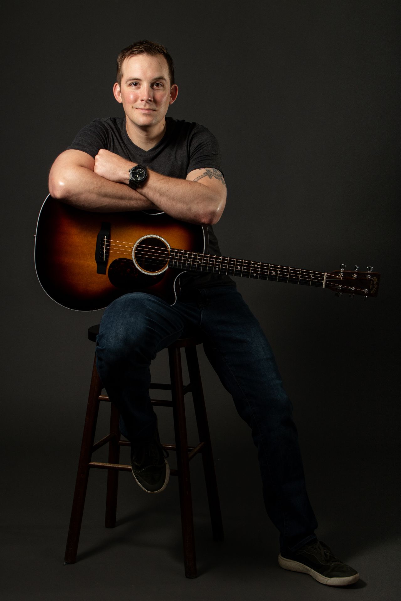 Chris Cooley playing acoustic guitar — music producer and engineer based in Gainesville, Virginia
